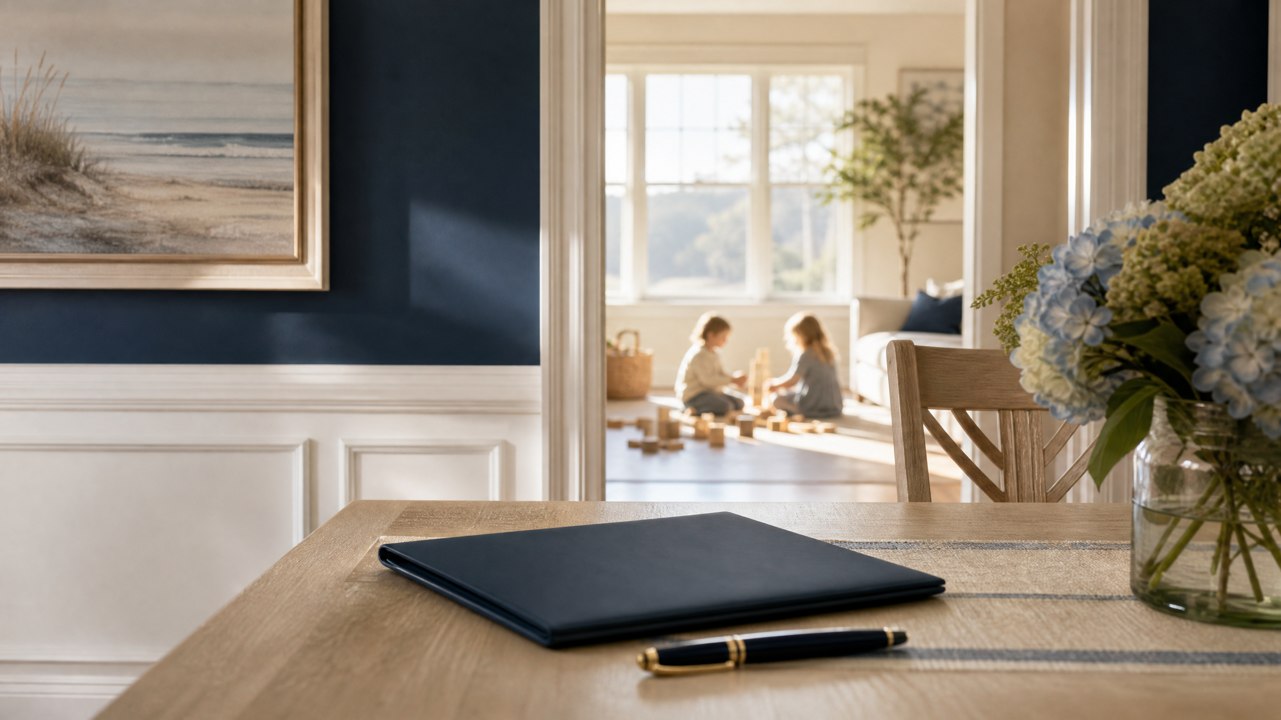 Estate planning folder and pen on a table while children play in a sunlit family home